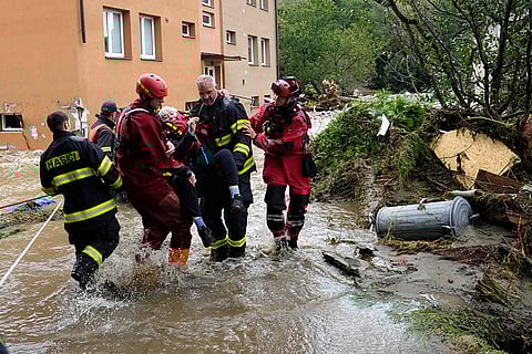 European Floods 2024: A resident is evacuated from her flooded house in Czech Republic
