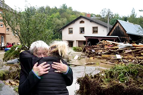 European Floods 2024: A resident hugs with her relative after being evacuated