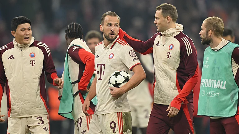 Harry Kane claims the match ball after Bayern Munich's dominant win - null