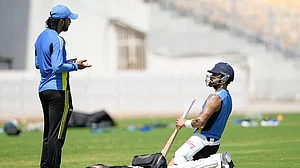 | Photo: AP/Mahesh Kumar A. : India vs Bangladesh Cricket: K L Rahul gestures with Virat Kohli during a training session