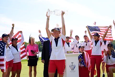 Solheim Cup Golf, United States vs Europe: United States Captain Stacy Lewis holds the winner's trophy after they beat Europe