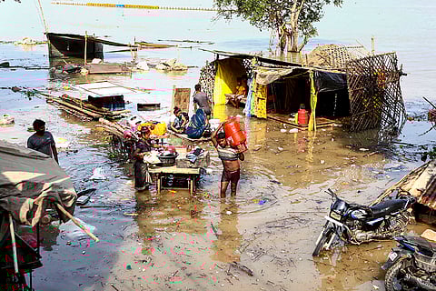 People living in low laying area shift their belongings in Prayagraj