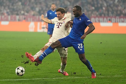 Champions League 2024-25, Bayern Munich vs GNK Dinamo: Bayern's Thomas Mueller, left, vies for the ball with Dinamo's Kevin Theophile-Catherine