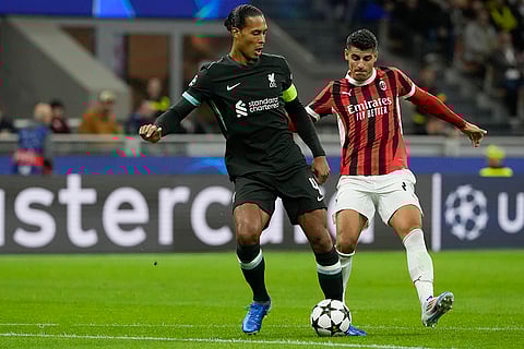 Champions League 2024-25, AC Milan and Liverpool: AC Milan's Alvaro Morata, right, challenges Liverpool's Virgil van Dijk