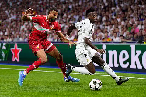Champions League 2024-25, Real Madrid vs VfB Stuttgart: Real Madrid's Vinicius Junior, right, tussles for the ball with Stuttgart's Josha Vagnoman