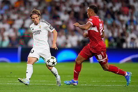 Champions League 2024-25, Real Madrid vs VfB Stuttgart: Real Madrid's Luka Modric, left, fights for the ball with Stuttgart's Jamie Leweling