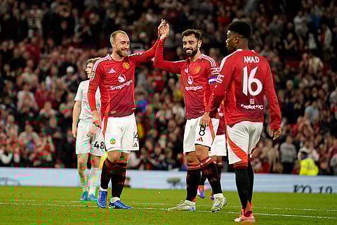 EFL Cup, Manchester United vs Barnsley: Manchester United's Christian Eriksen, left, celebrates with Bruno Fernandes after he scored his side's 7th goal