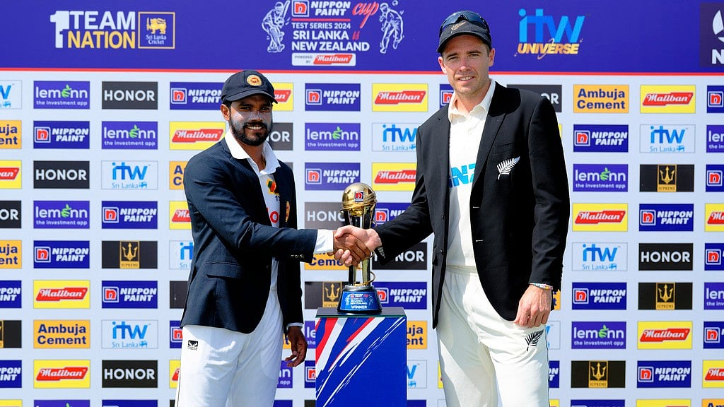 AP/Viraj Kothalawala : Captains Dhananjaya de Silva (left) and Tim Southee pose with the trophy ahead of the first Sri Lanka vs New Zealand Test in Galle, starting Wednesday (September 18, 2024).