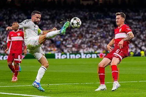 Champions League 2024-25, Real Madrid vs VfB Stuttgart: Real Madrid's Dani Carvajal, left, shoots the ball next to Stuttgart's Angelo Stiller