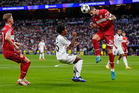 Champions League 2024-25, Real Madrid vs VfB Stuttgart: Stuttgart's Jeff Chabot, right, heads the ball next to Real Madrid's Endrick