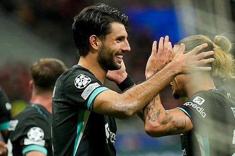 Champions League 2024-25, AC Milan and Liverpool: Liverpool's Dominik Szoboszlai is congratulated by Kostas Tsimikas after scoring his side's 3rd goal