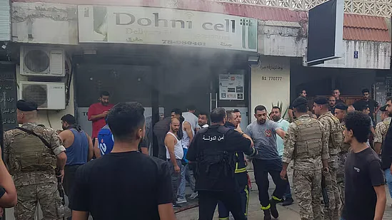 Lebanese soldiers and firefighters gathered after walkie-talkie blast in Lebanon today