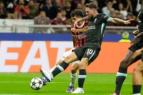 Champions League 2024-25, AC Milan and Liverpool: AC Milan's Christian Pulisic, back, scores his side's opening goal challenged by Liverpool's Alexis Mac Allister