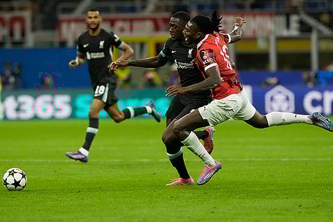 Champions League 2024-25, AC Milan and Liverpool: AC Milan's Rafael Leao, right, and Liverpool's Ibrahima Konate vie for the ball