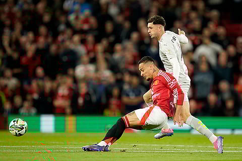 EFL Cup, Manchester United vs Barnsley: Manchester United's Antony, left, and Barnsley's Corey O'Keeffe battle for the ball