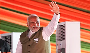 PTI : Prime Minister Narendra Modi waves to supporters during a public meeting ahead of the second phase of Jammu and Kashmir Assembly elections, in Srinagar, Thursday, Sept. 19, 2024.