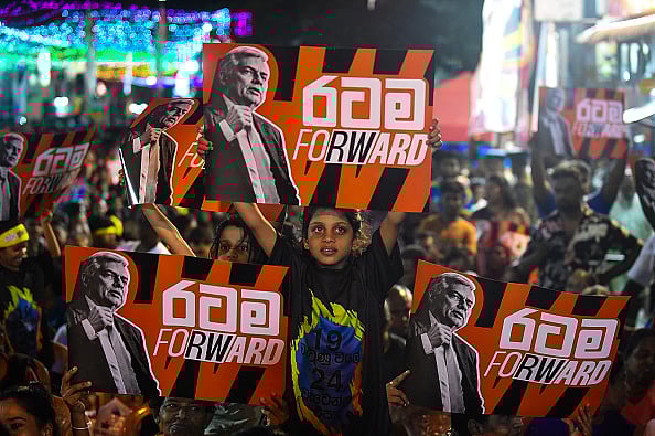 Supporters of Sri Lanka's president and independent presidential candidate Ranil Wickremesinghe attend an election rally ahead of the upcoming presidential elections in Colombo - Getty Images