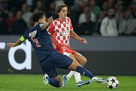 UEFA Champions League, PSG vs Girona: PSG's Marquinhos clears the ball in front of Girona's Bryan Gil