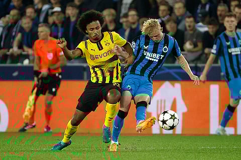 UEFA Champions League, Club Brugge vs Borussia Dortmund: Brugge's Joaquin Seys, right, and Dortmund's Karim Adeyemi challenge for the ball