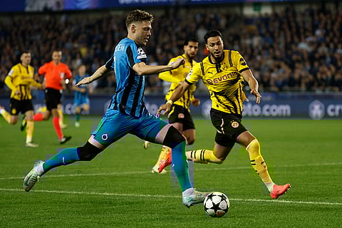 UEFA Champions League, Club Brugge vs Borussia Dortmund: Brugge's Gustaf Nilsson, left, and Dortmund's Ramy Bensebaini fight for the ball