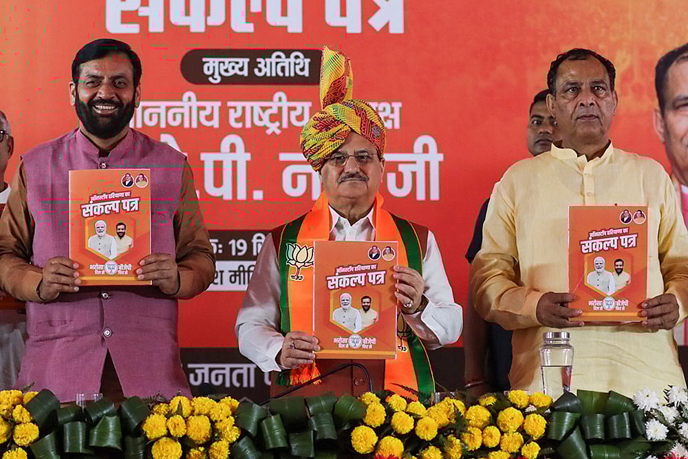 Photo: PTI : BJP's manifesto for Haryana polls released