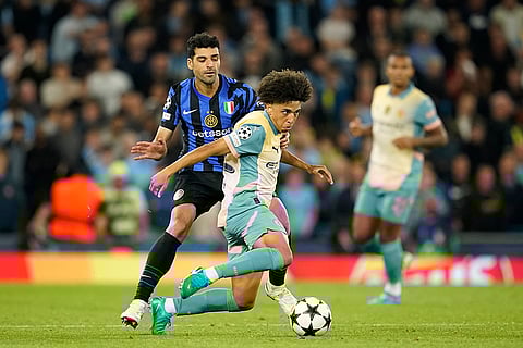UEFA Champions League, Manchester City vs Inter Milan: Manchester City's Rico Lewis, right, is challenged by Inter Milan's Mehdi Taremi