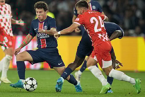 UEFA Champions League, PSG vs Girona: Girona's Portu, right, and PSG's Joao Neves fight for the ball