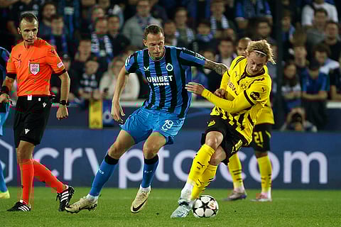 UEFA Champions League, Club Brugge vs Borussia Dortmund: Brugge's Gustaf Nilsson and Dortmund's Julian Brandt challenge for the ball
