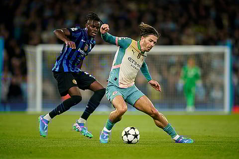 UEFA Champions League, Manchester City vs Inter Milan: Manchester City's Jack Grealish, right, is challenged by Inter Milan's Yann Bisseck
