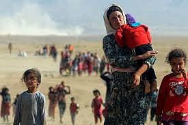 AP : Yazidi woman with her children in Syria