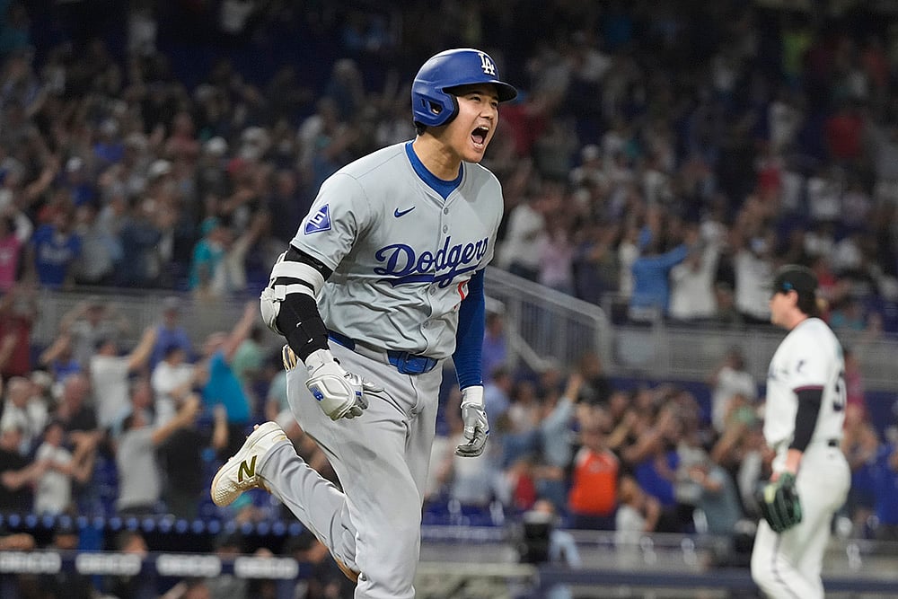 | Photo: AP/Marta Lavandier : Dodgers vs Marlins Baseball: Los Angeles Dodgers' Shohei Ohtani (17) reacts after hitting his 50th home run of the season