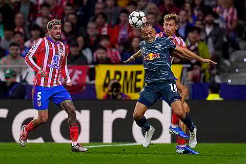 UEFA Champions League, RB Leipzig vs Atletico Madrid: Leipzig's Xavi Simons, second right, vies for the ball with Atletico Madrid's Marcos Llorente
