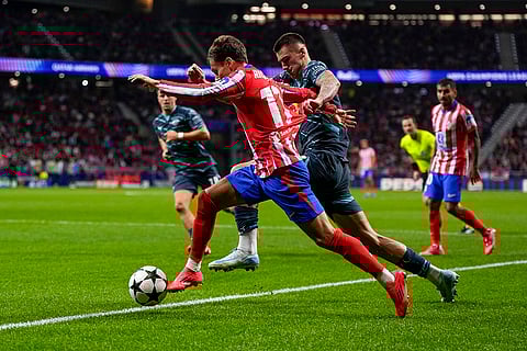 UEFA Champions League, RB Leipzig vs Atletico Madrid: Atletico Madrid's Rodrigo Riquelme, left, vies for the ball with Leipzig's Benjamin Sesko