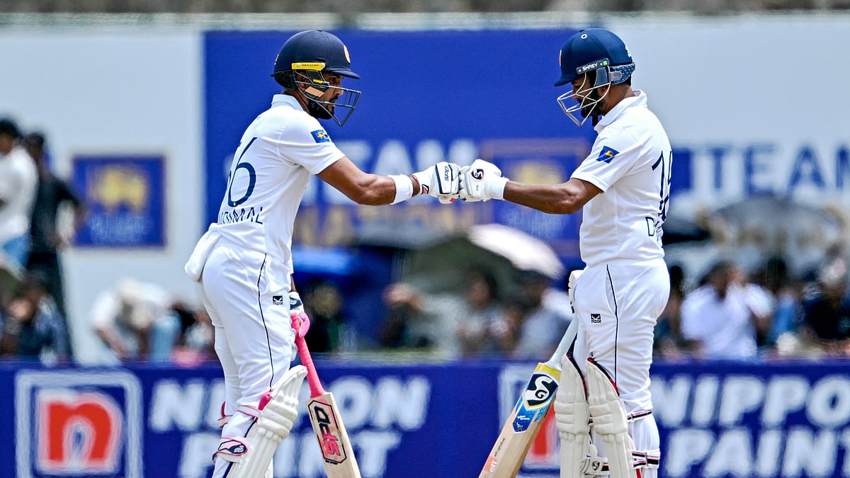 Dinesh Chandimal and Dimuth Karunaratne helped Sri Lanka maintain their impressive start on day two