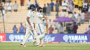 AP/Mahesh Kumar A. : India's Ravichandran Ashwin, left, and Ravindra Jadeja leave the field at the end of the first day of the first cricket Test match.