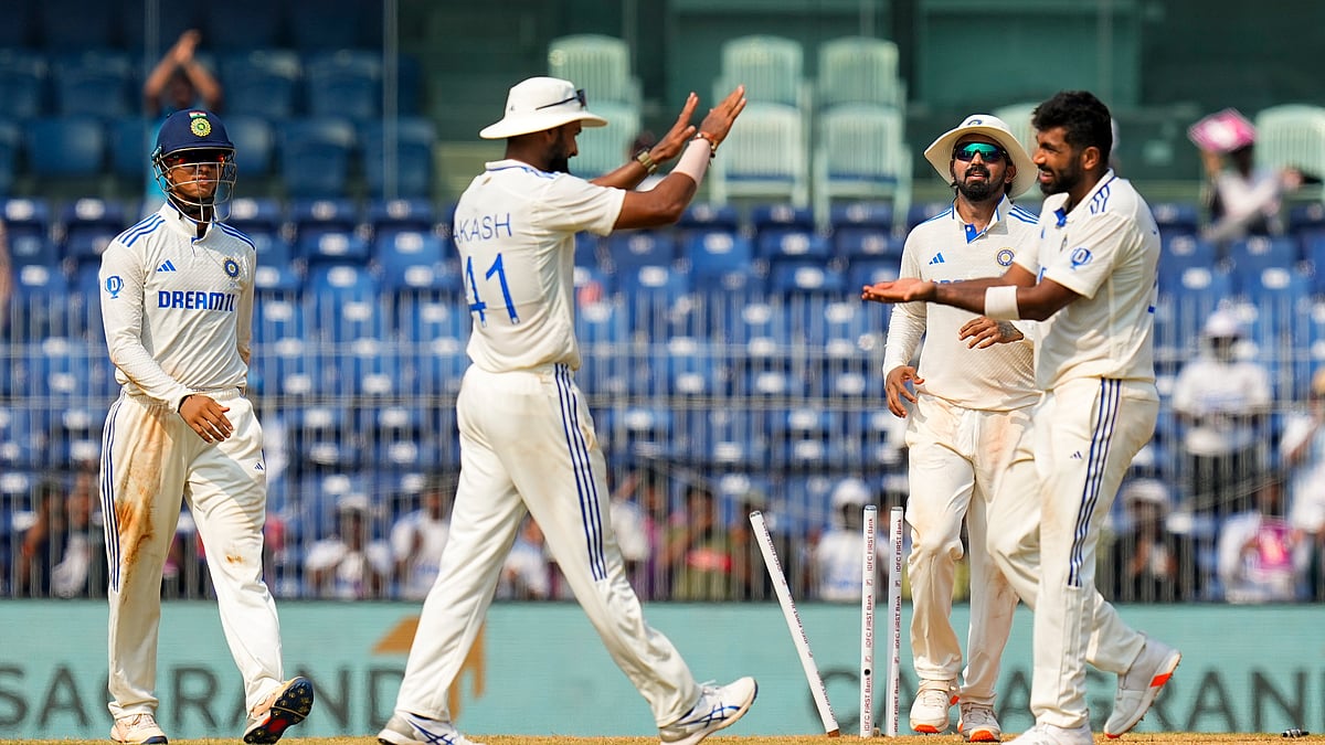 Indias Jasprit Bumrah celebrates with teammates. PTI Photo