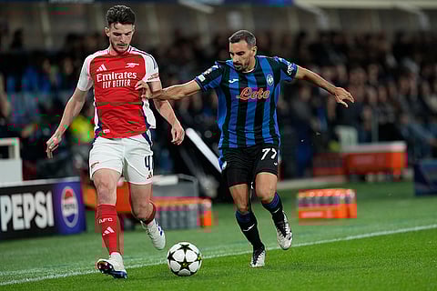 Champions League 2024-25, Atalanta Vs Arsenal: Arsenal's Declan Rice, left, and Atalanta's Davide Zappacosta challenge for the ball