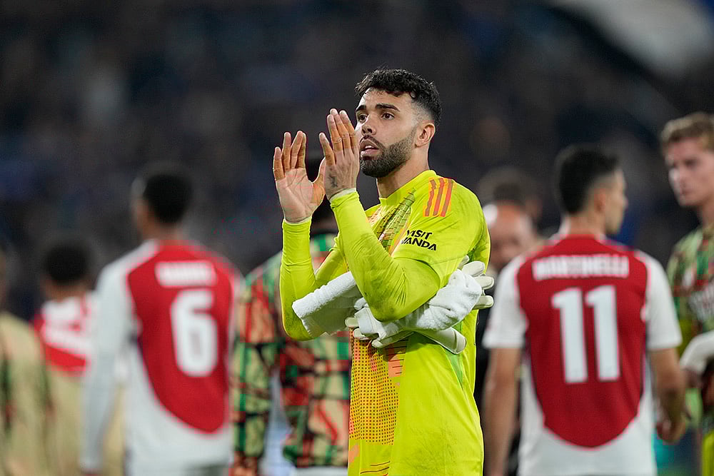 | Photo: AP/Antonio Calanni : Champions League 2024-25, Atalanta Vs Arsenal: Arsenal's goalkeeper David Raya applauds after the match
