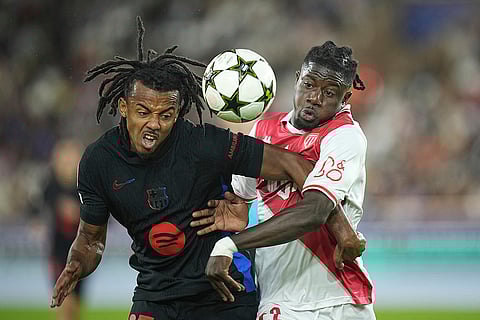 UEFA Champions League, Monaco and Barcelona: Barcelona's Jules Kounde, left, fights for the ball with Monaco's Mohammed Salisu