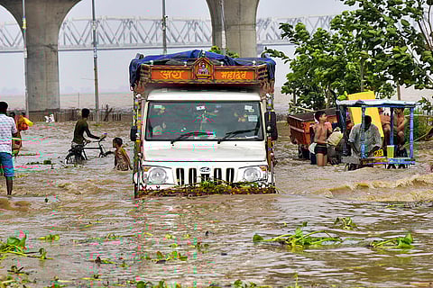 Bihar Flood: Vehicles pass through a waterlogged road