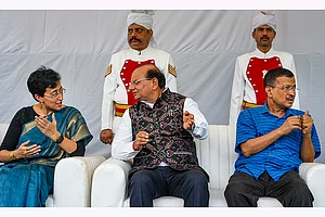 | Photo: PTI/Kamal Singh : Delhi Lt. Governor V.K. Saxena with former chief minister Arvind Kejriwal and CM-designate Atishi