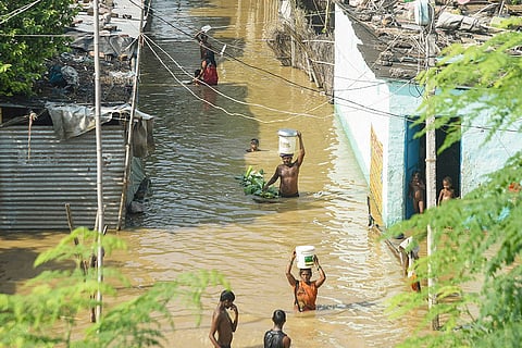 Bihar Flood: People wade through floodwaters of the Ganga river