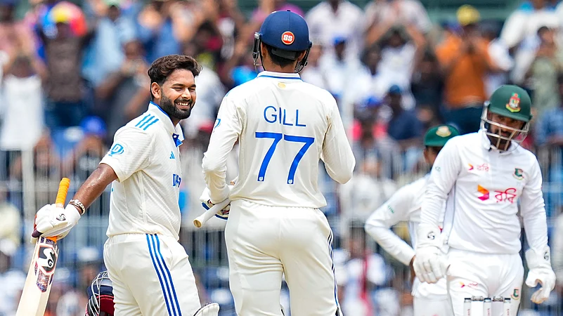 Indias Rishabh Pant celebrates his century with Shubman Gill. PTI