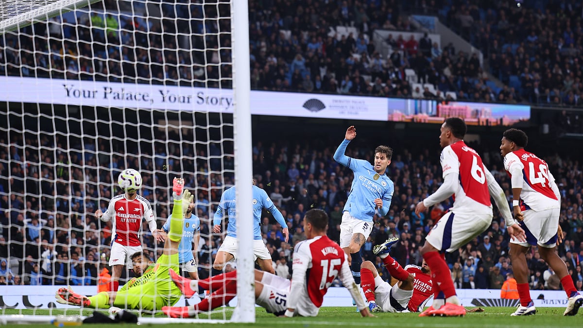 John Stones scored late to salvage a point for Manchester City against Arsenal - null