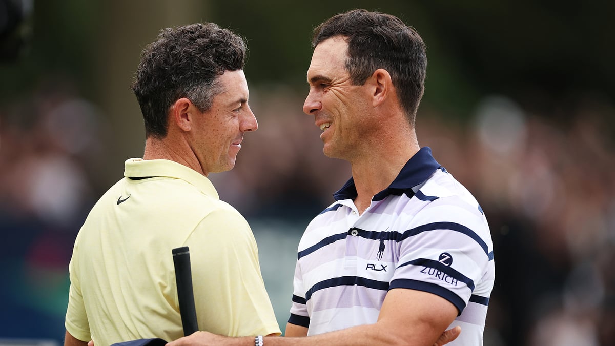 Rory McIlroy and Billy Horschel embrace after the latter's victory