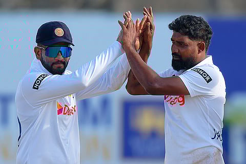 Sri Lanka vs New Zealand 1st Test: Sri Lanka's Prabath Jayasuriya and teammate Dimuth Karunaratne celebrate the wicket of New Zealand's Glenn Phillips