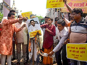 PTI : Sanskriti Bachao Manch activists burn an effigy during a protest against the alleged use of animal fat in the preparation of laddoos as offerings at Tirupati Balaji temple, in Bhopal, Friday, Sept. 20, 2024.