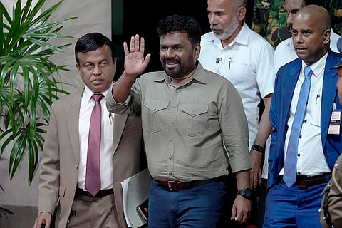 Sri Lanka elections result 2024: Marxist lawmaker Anura Kumara Dissanayake waves as he departs the election commission office