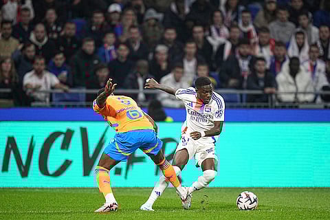 Ligue 1 Soccer, Marseille vs Lyon: Lyon's Ernest Nuamah, right, challenges Marseille's Ulisses Garcia for the ball