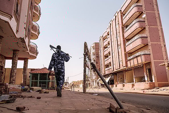 via Getty : An armed policeman walk in the area of the Souk, in the city of Omdurman, Sudan, on June 15, 2024.